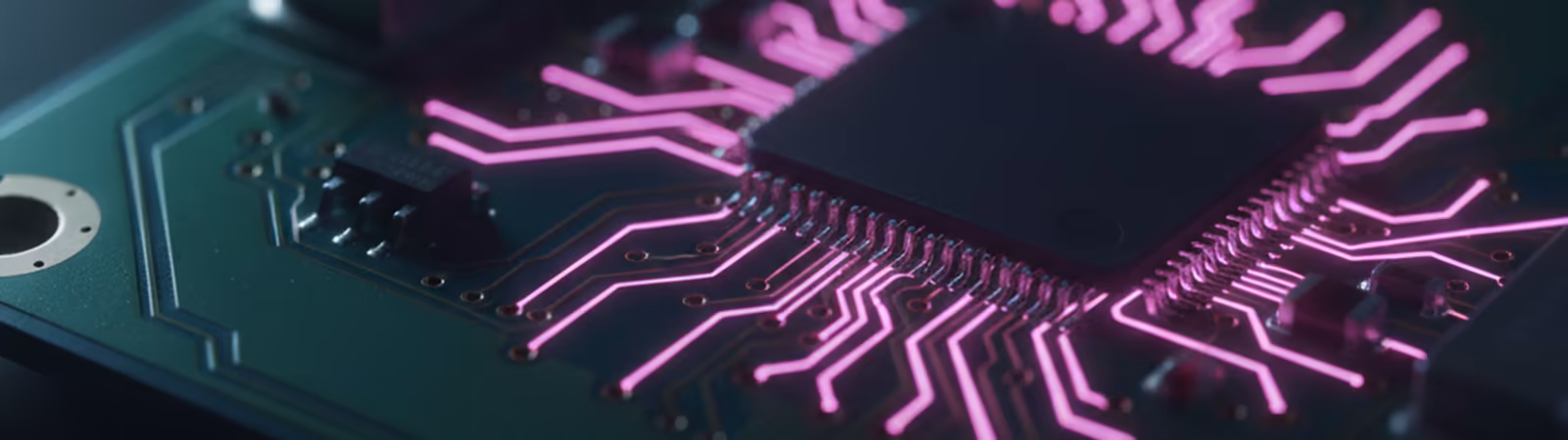 Macro of a circuit board with magenta highlights