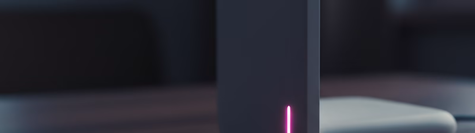 Side macro of a slim wifi router with a magenta LED